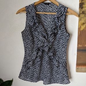 Sleeveless, ruffled blouse